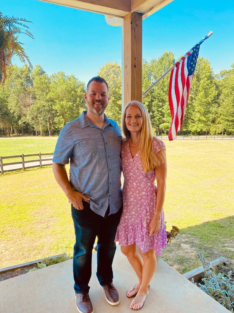 Adam and Tammy Pritchett on their porch